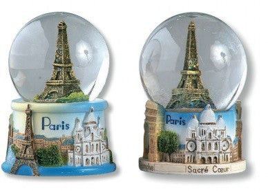 Boule de neige avec la Tour Eiffel et autres monuments de Paris, sous une pluie de neige et de paillettes.